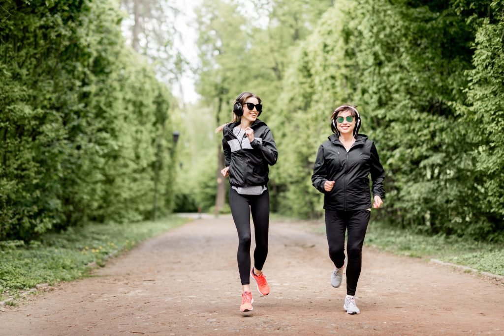 Two women running in the park